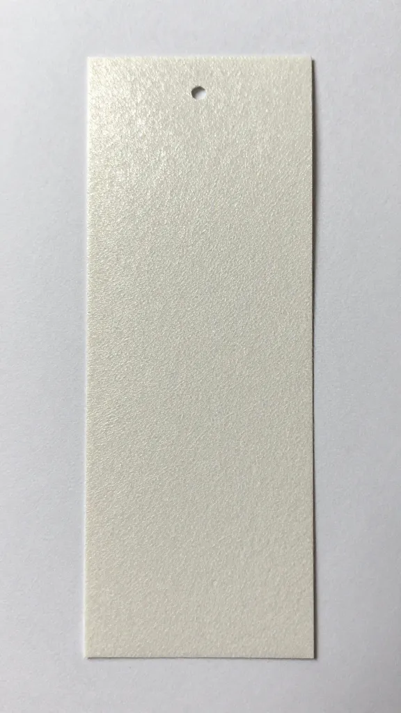 Closeup of a handmade paper bookmark with breathable coating shine