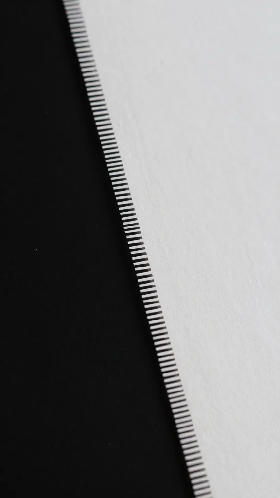 Closeup of precise paper cut filament edge illuminated studio light