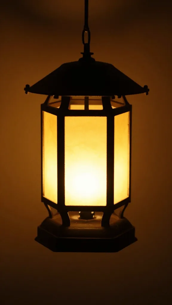 Closeup of a single tube cut into mini lantern with warm lighting