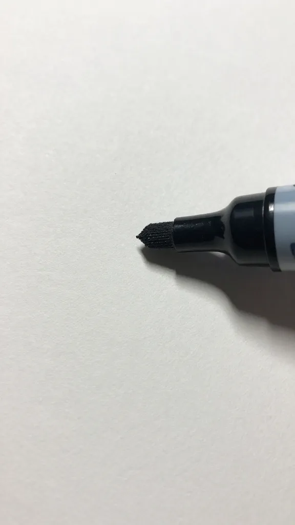 closeup of a single glittery marker drawing on craft paper