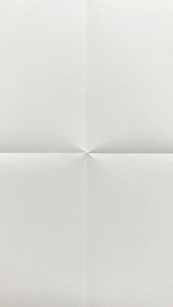 closeup of a clean, sharpened pre-fold crease on cardstock